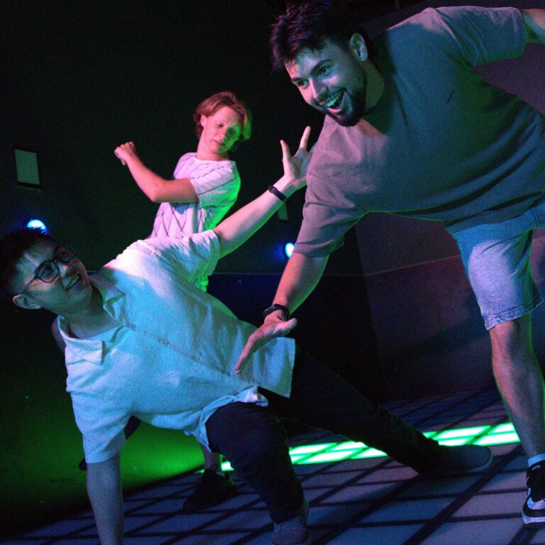Group enjoying an immersive game room activity at PowerPlay Sydney