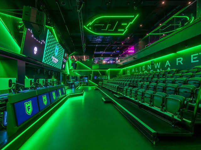 Fortress Sydney gaming arena with green lighting and seating for group events