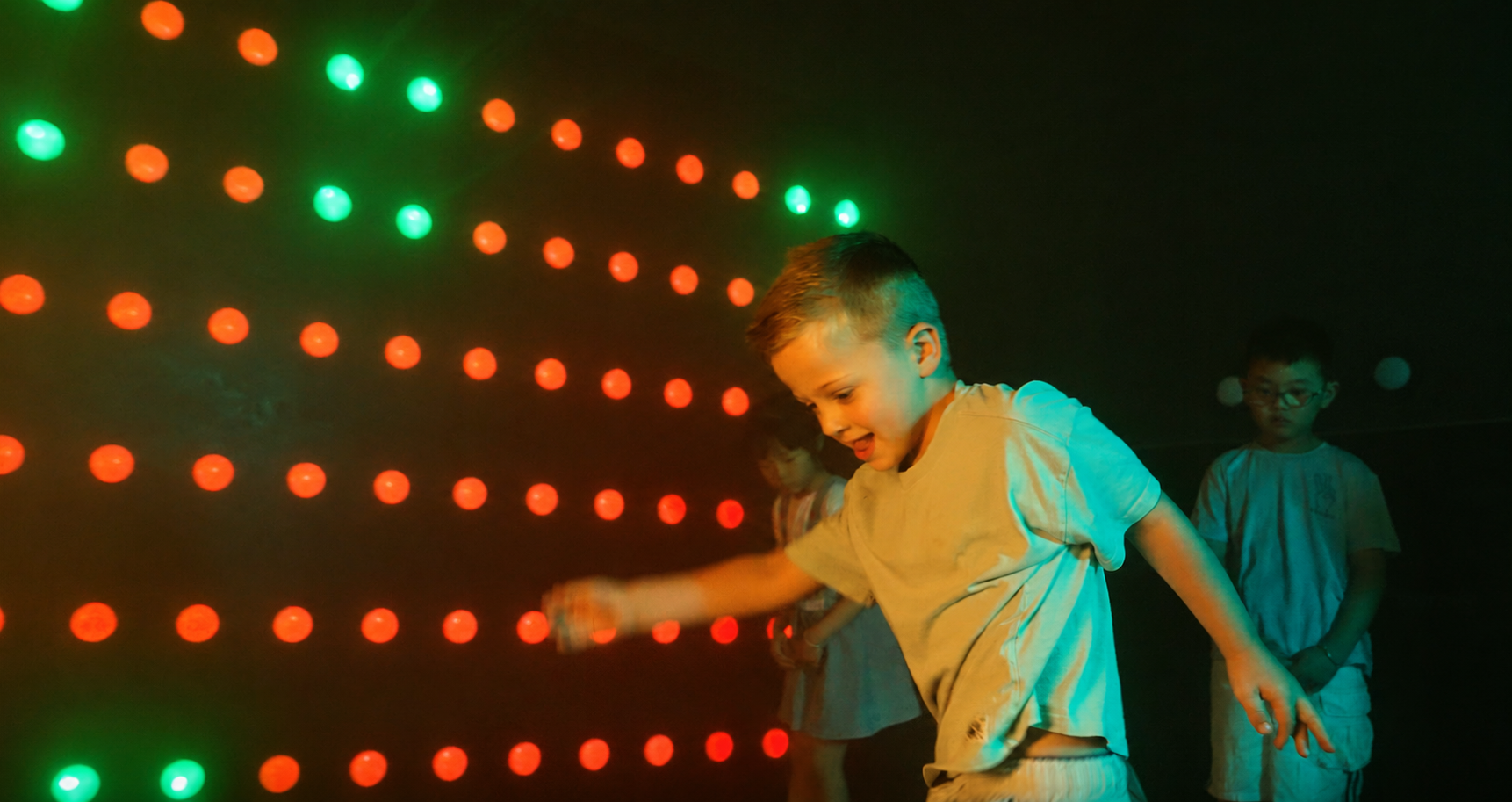 Power Play Sydney indoor game room with kids playing an interactive light wall activity