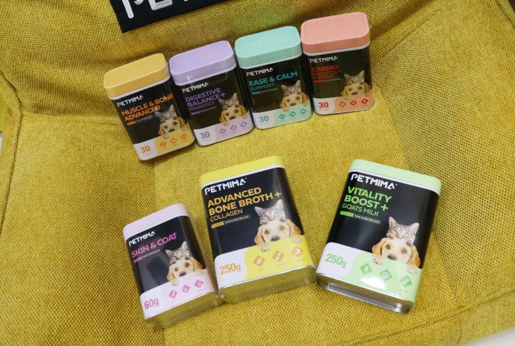 Petmima dog and cat supplement range displayed on a yellow chair